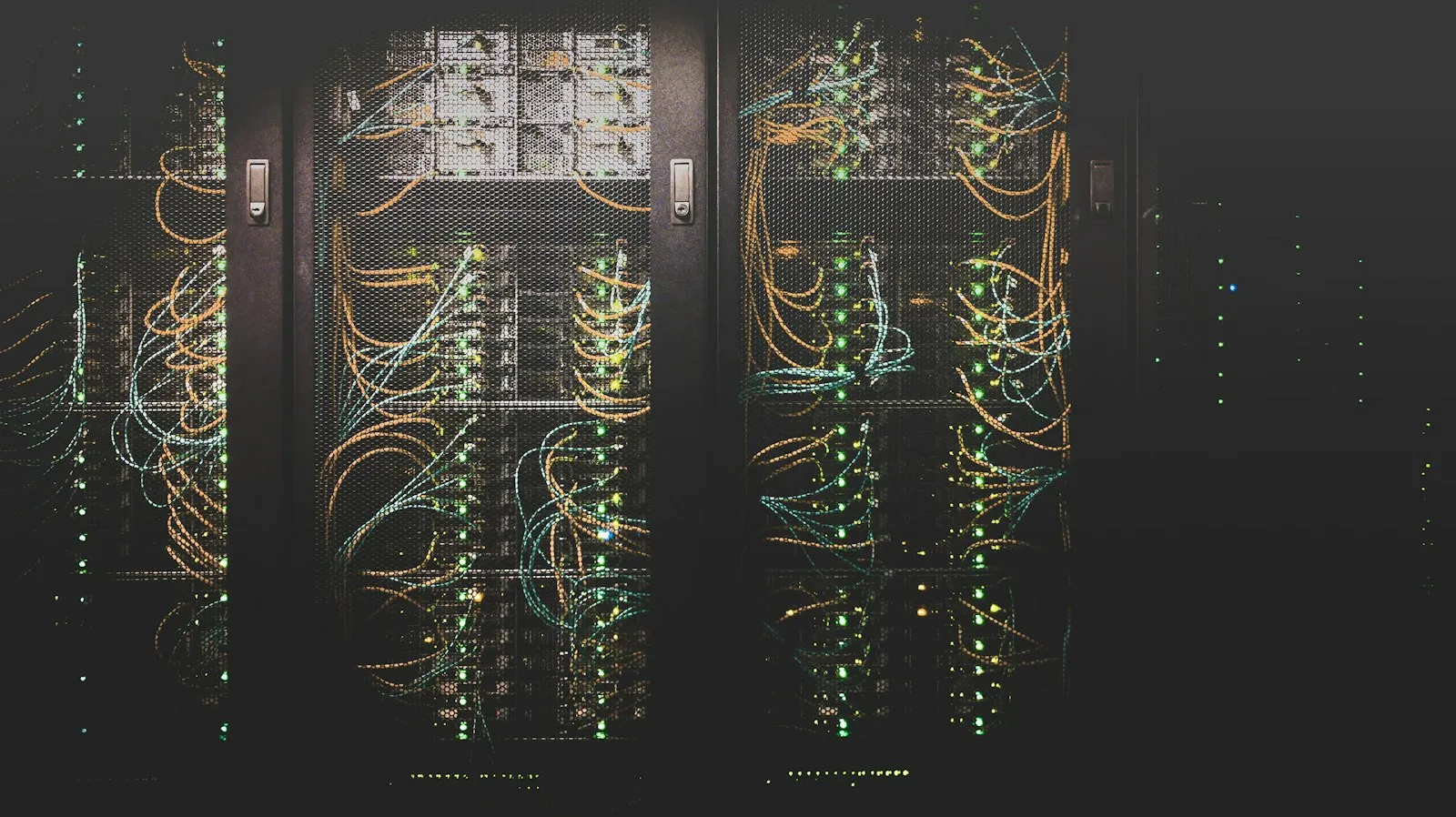 Rows of illuminated server racks in a modern data centre.
